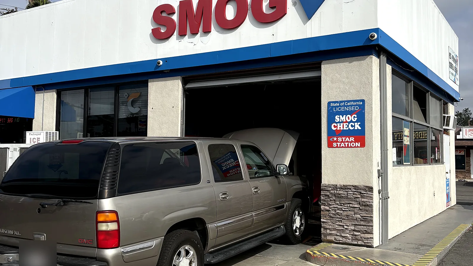 Vehicles we service in Escondido, CA: a full-size SUV with the hood up in our East Valley Parkway bay